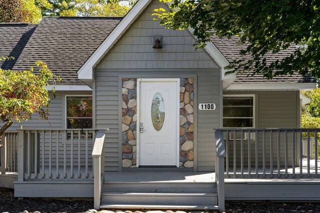 entrance to property with a wooden deck