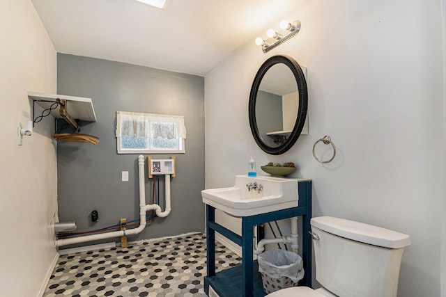 bathroom with sink and toilet