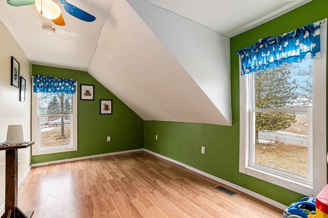 bonus room with vaulted ceiling, ceiling fan, and hardwood / wood-style floors