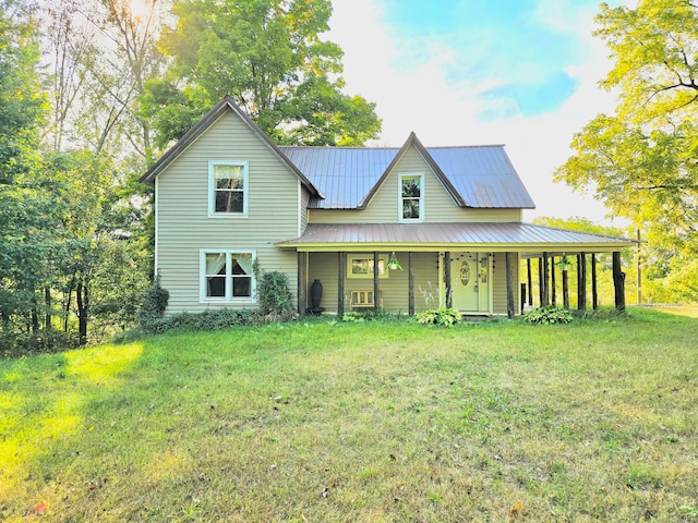 view of front of house with a front yard and a porch