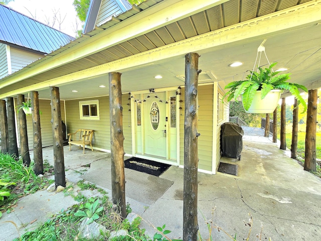 view of patio featuring area for grilling and a porch