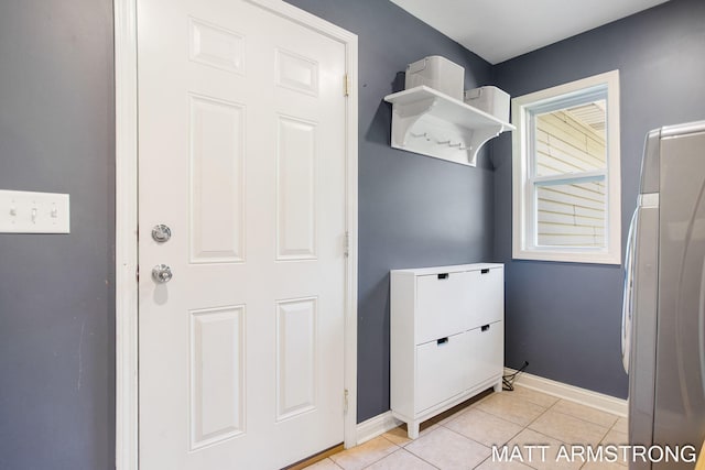 mudroom with light tile patterned floors