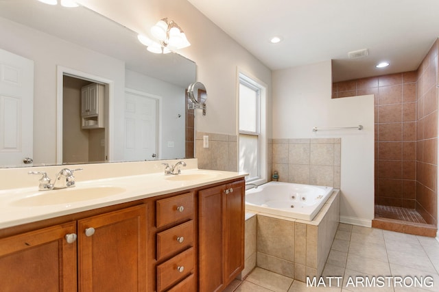 bathroom featuring vanity, shower with separate bathtub, and tile patterned flooring