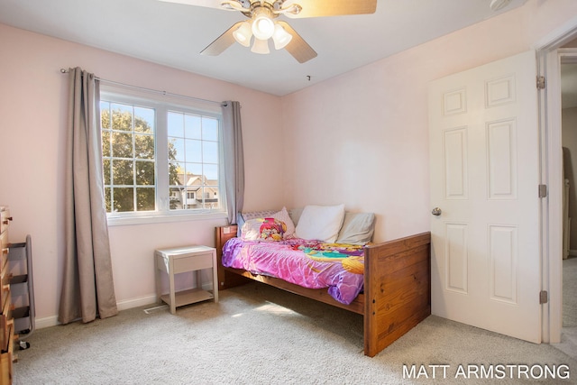 carpeted bedroom featuring ceiling fan