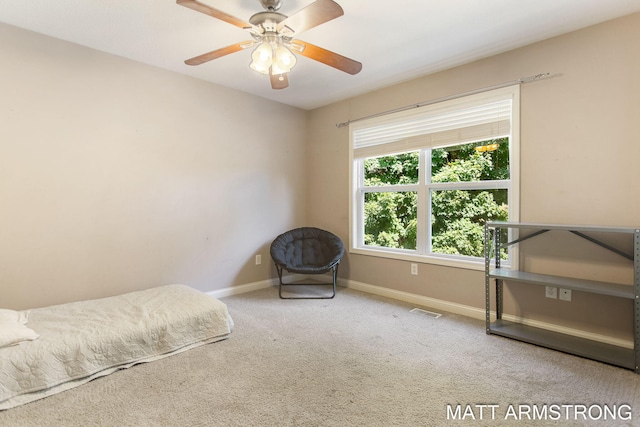 unfurnished bedroom with ceiling fan and carpet flooring