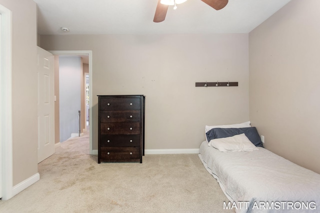 bedroom with light carpet and ceiling fan