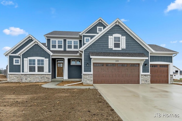 craftsman inspired home featuring a garage