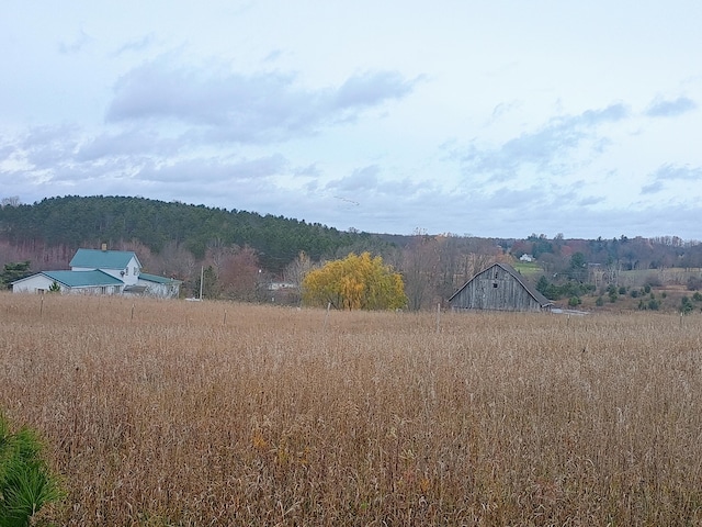 view of mountain feature with a rural view