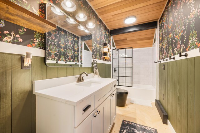 full bathroom with tiled shower / bath, vanity, toilet, and wooden ceiling