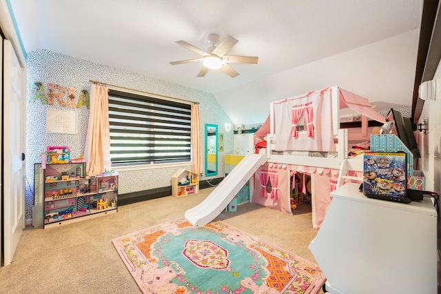 bedroom with ceiling fan, lofted ceiling, light carpet, and a closet