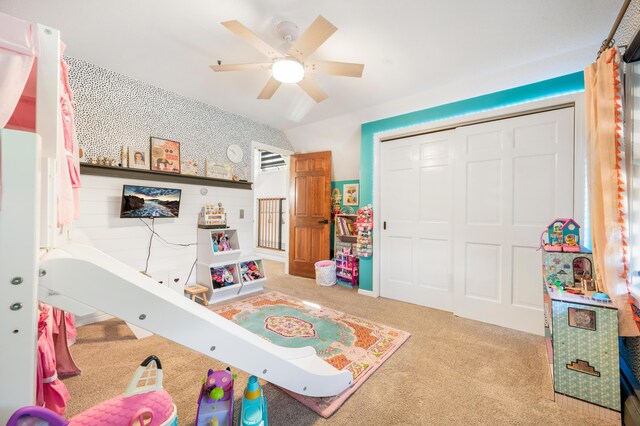 rec room with ceiling fan and light colored carpet