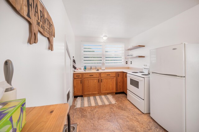 kitchen featuring light carpet, sink, and white appliances