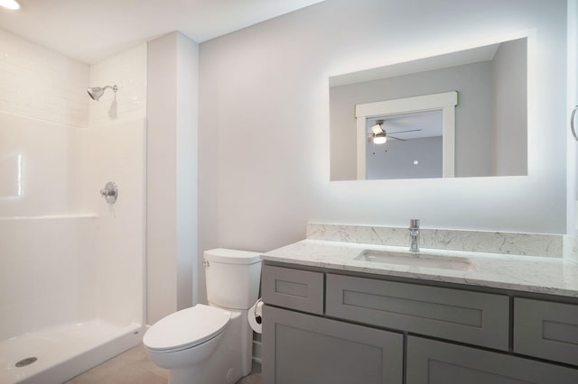 bathroom featuring walk in shower, vanity, and toilet