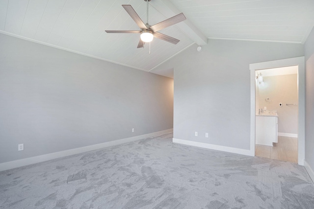 spare room with vaulted ceiling with beams, light colored carpet, wooden ceiling, and ceiling fan