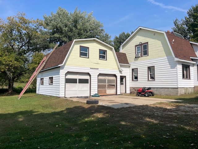 exterior space with a garage and a front lawn