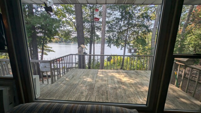 wooden terrace featuring a water view