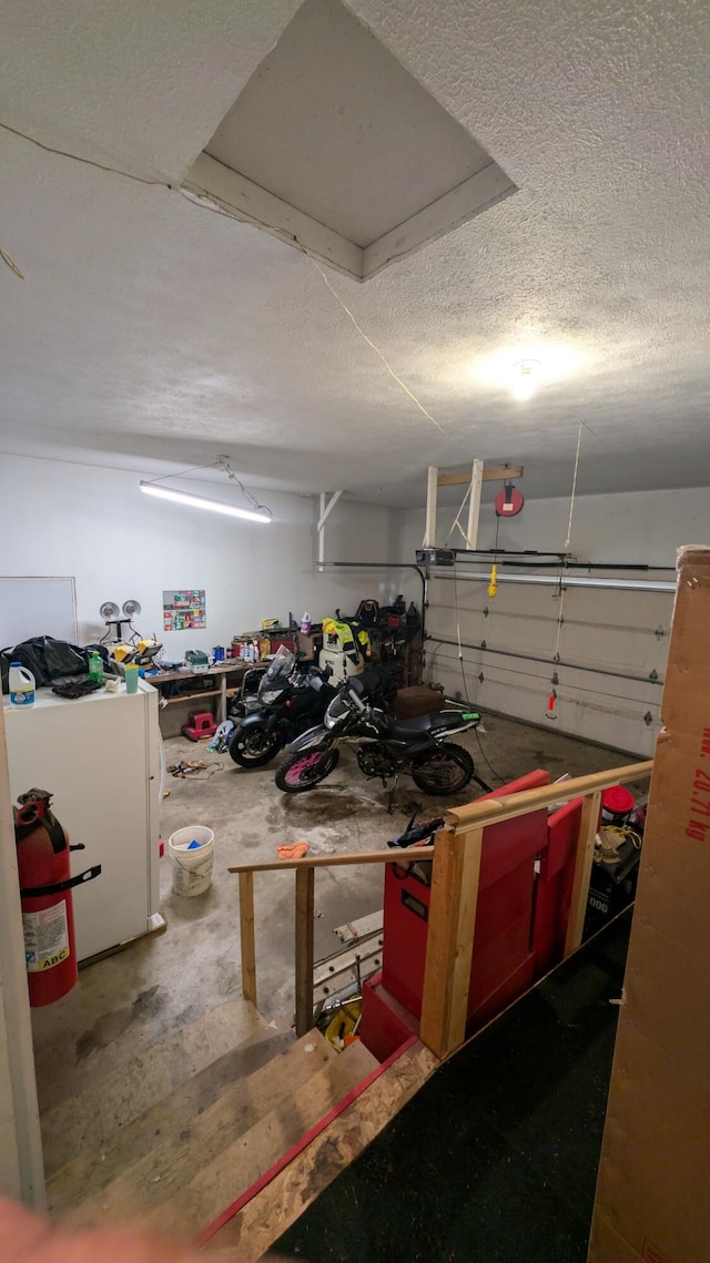 garage with white fridge