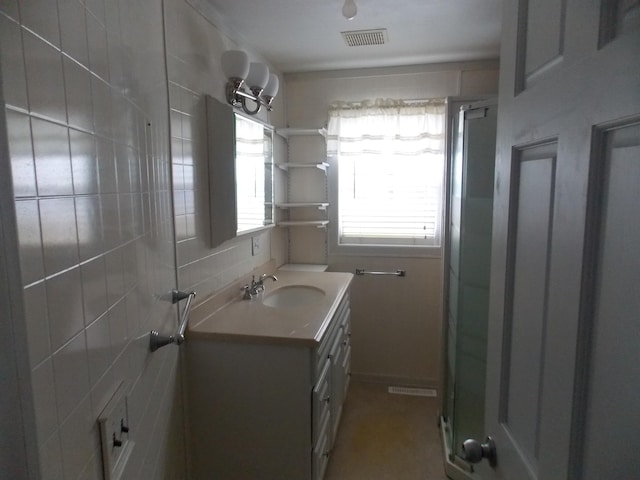 bathroom with vanity and an enclosed shower