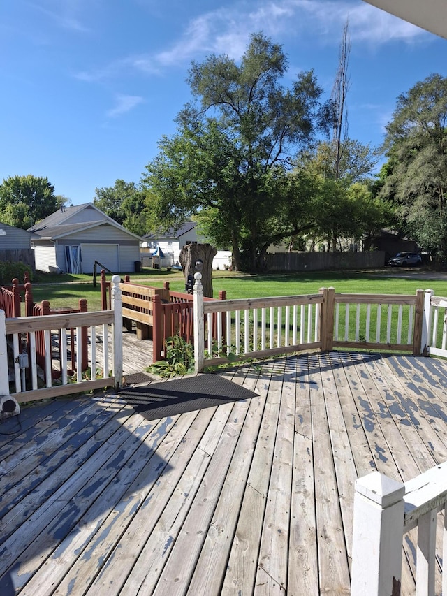 wooden terrace with a yard