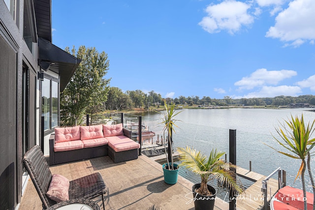 view of patio / terrace featuring a balcony, a water view, and outdoor lounge area