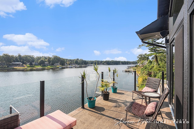 dock area featuring a balcony and a water view