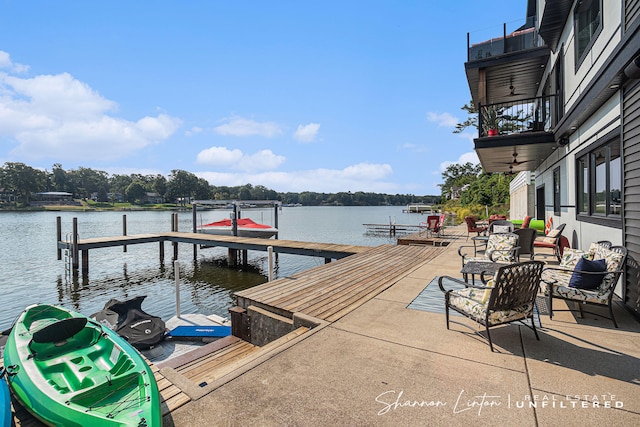 dock area featuring a balcony and a water view