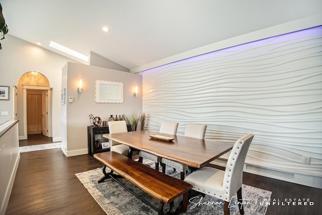 dining room with dark wood finished floors, baseboards, lofted ceiling, and recessed lighting