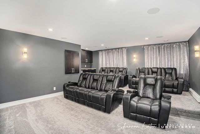 cinema room featuring baseboards, light colored carpet, and recessed lighting