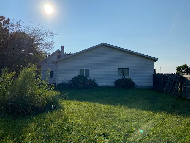 view of home's exterior with a yard