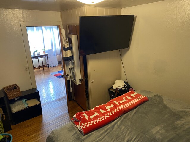 bedroom with wood finished floors
