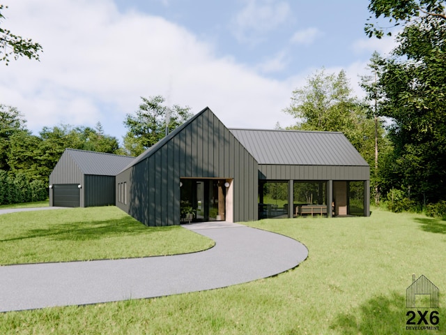 exterior space featuring an outdoor structure, a garage, and a front yard