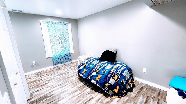 bedroom featuring hardwood / wood-style flooring