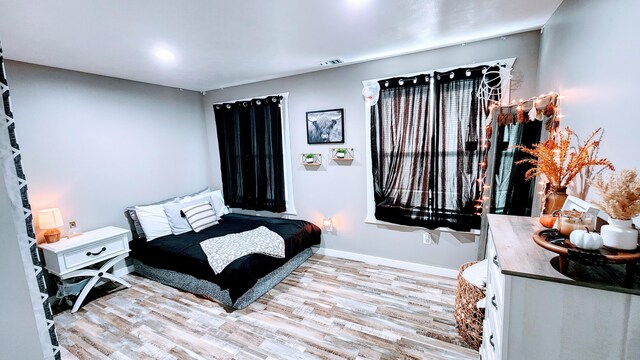 bedroom with light hardwood / wood-style flooring