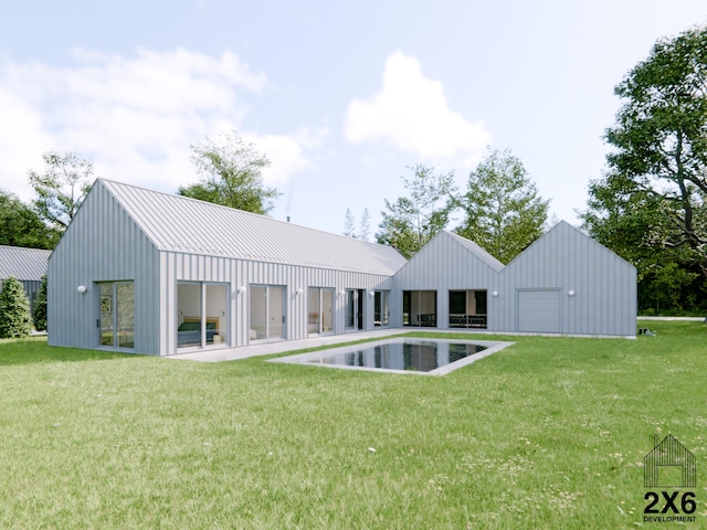 rear view of house featuring an outdoor structure and a yard