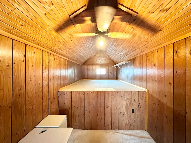 additional living space featuring wood ceiling, wood walls, lofted ceiling, ceiling fan, and carpet