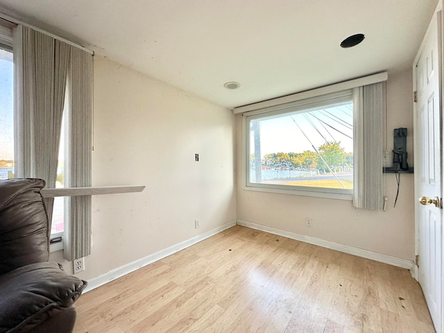 spare room with light hardwood / wood-style flooring