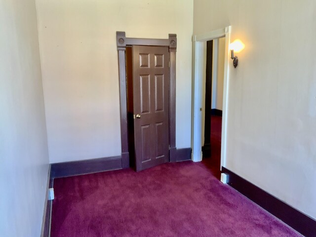 empty room with carpet flooring