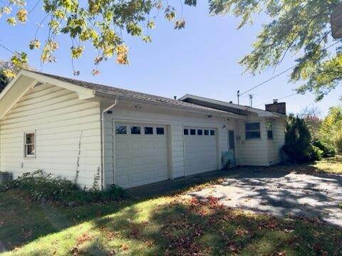 view of property exterior featuring a garage