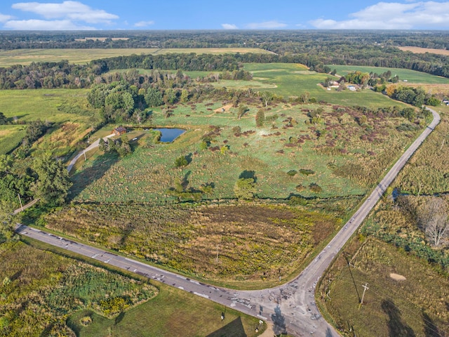 birds eye view of property featuring a rural view