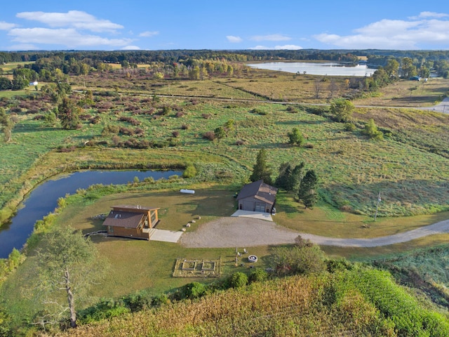 birds eye view of property with a water view and a rural view