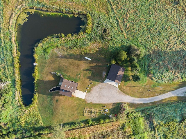 birds eye view of property with a rural view and a water view