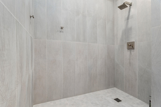 bathroom with tiled shower