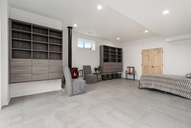 bedroom with a wood stove