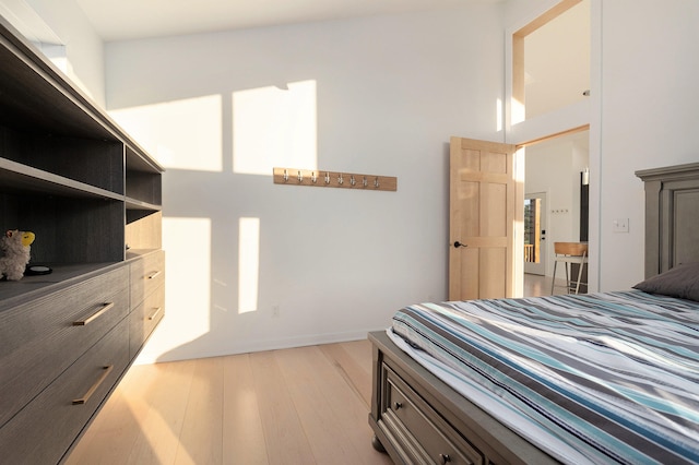 bedroom with light wood-type flooring