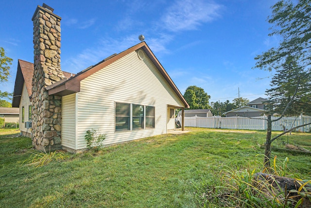 back of house with a yard