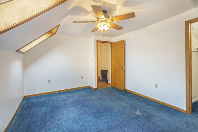 additional living space with ceiling fan, lofted ceiling, and carpet flooring