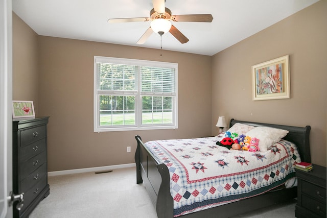 bedroom featuring ceiling fan and light carpet