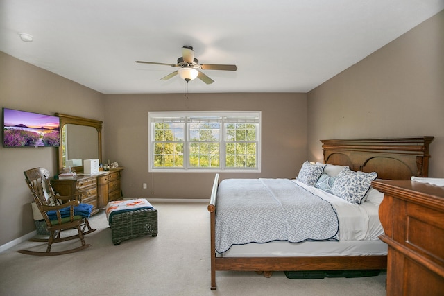 bedroom with light carpet and ceiling fan