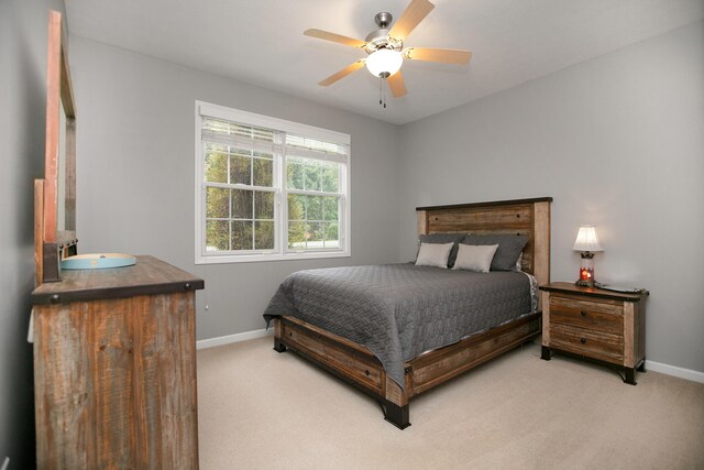 bedroom featuring ceiling fan and carpet