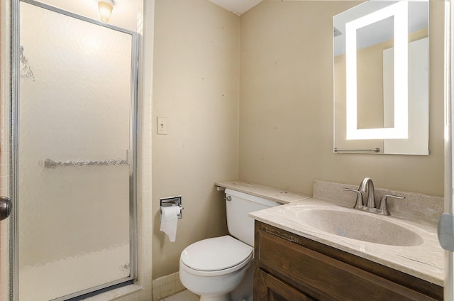 full bath featuring vanity, toilet, and a stall shower